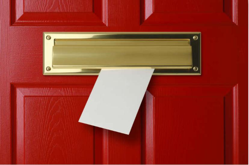 Letter coming through a letter box