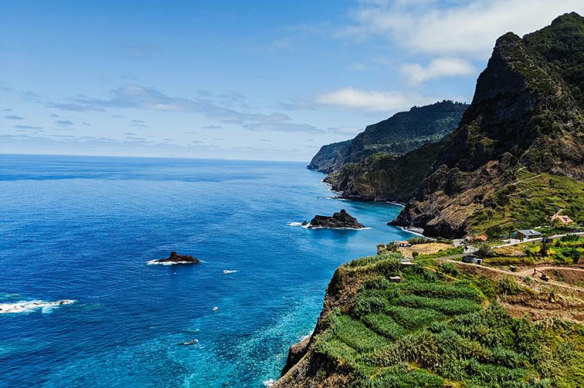 Madeira's beautiful coastline features verdant cliffs and azure waters (Credit: Stephen Lammens/Unsplash)