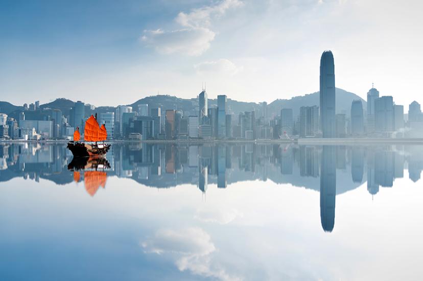 Hong Kong skyline and junk boat iStock