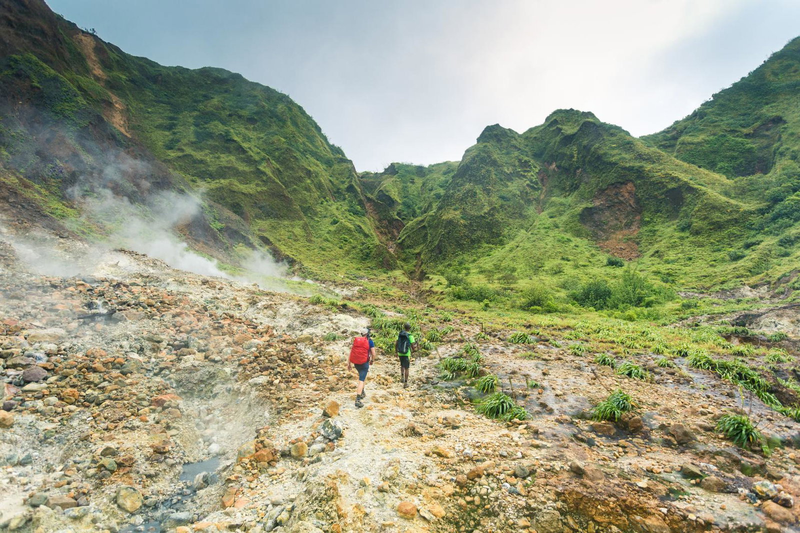 Two hikers on a trail in Dominica