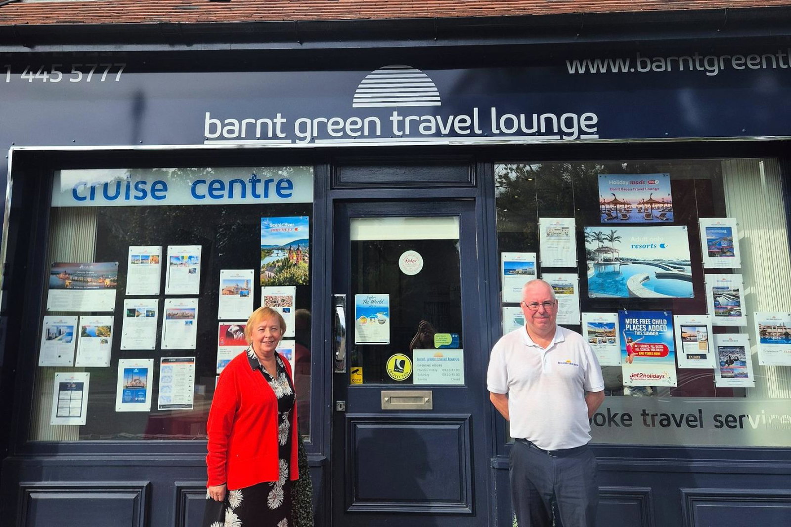 Barnt Green Travel Lounge's Linda Green and Mike Allsopp pictured outside the agency