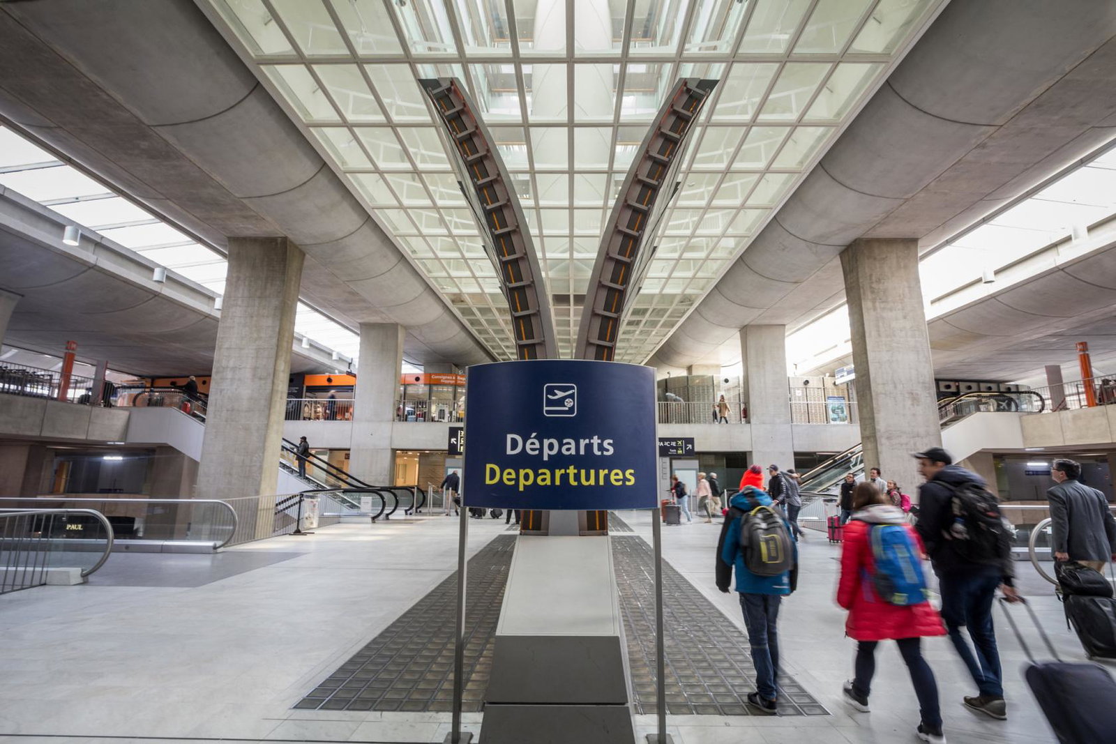 People head to the departure gates at Paris's Charles de Gaulle airport