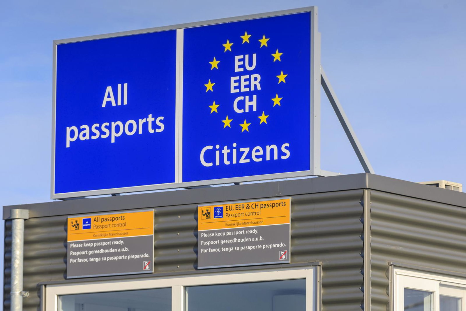 A border control point asking for all passports with the EU stars