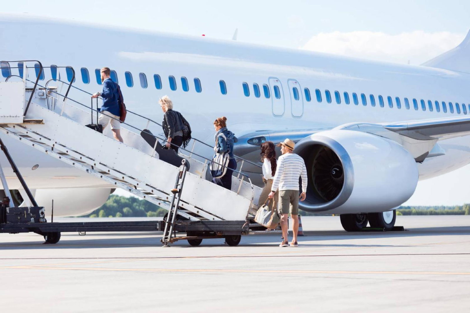 Travellers boarding a plane