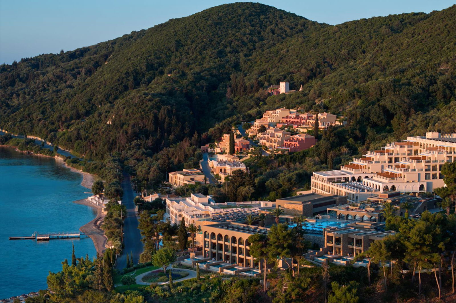 Aerial view of MarBella resort, a hotel sat in a sweeping, tree-covered cove