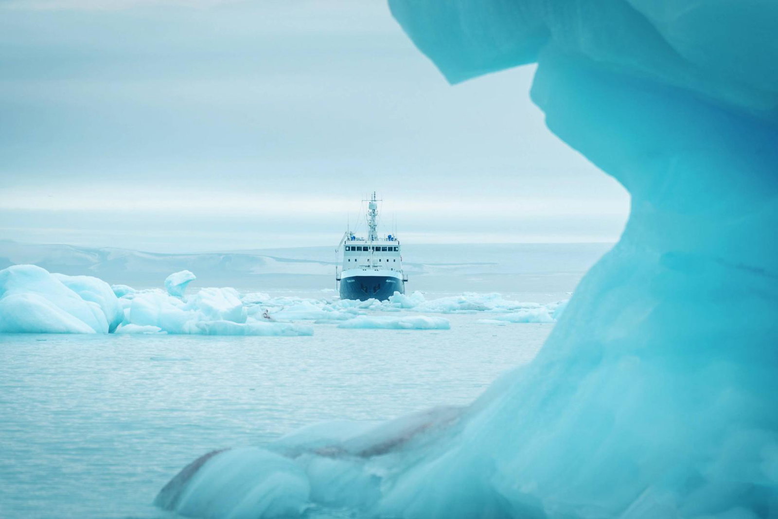 The ship Polar Athena sits in sea ice - credit Lars Korvald for Secret Atlas