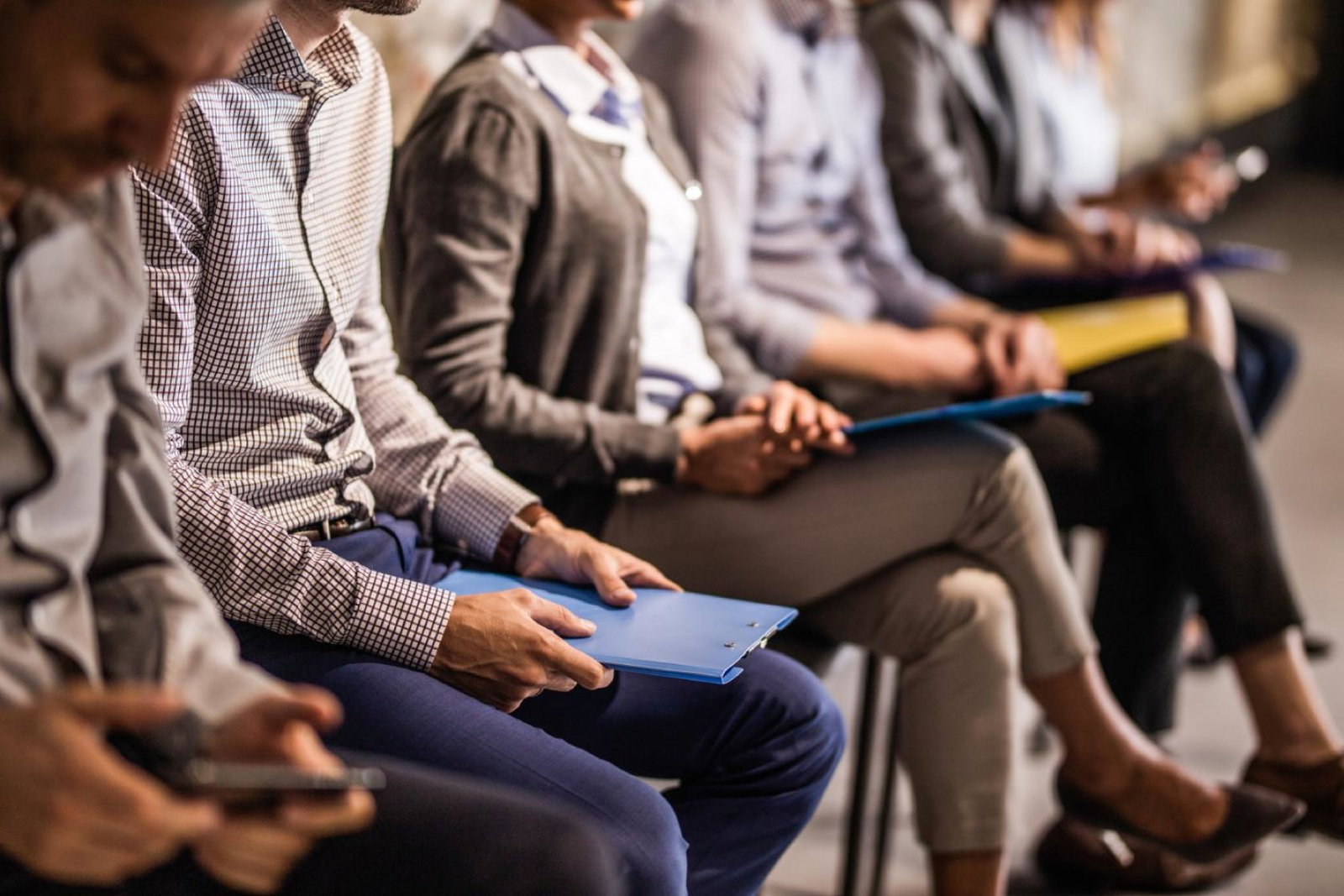 Job candidates wait to be seen for roles