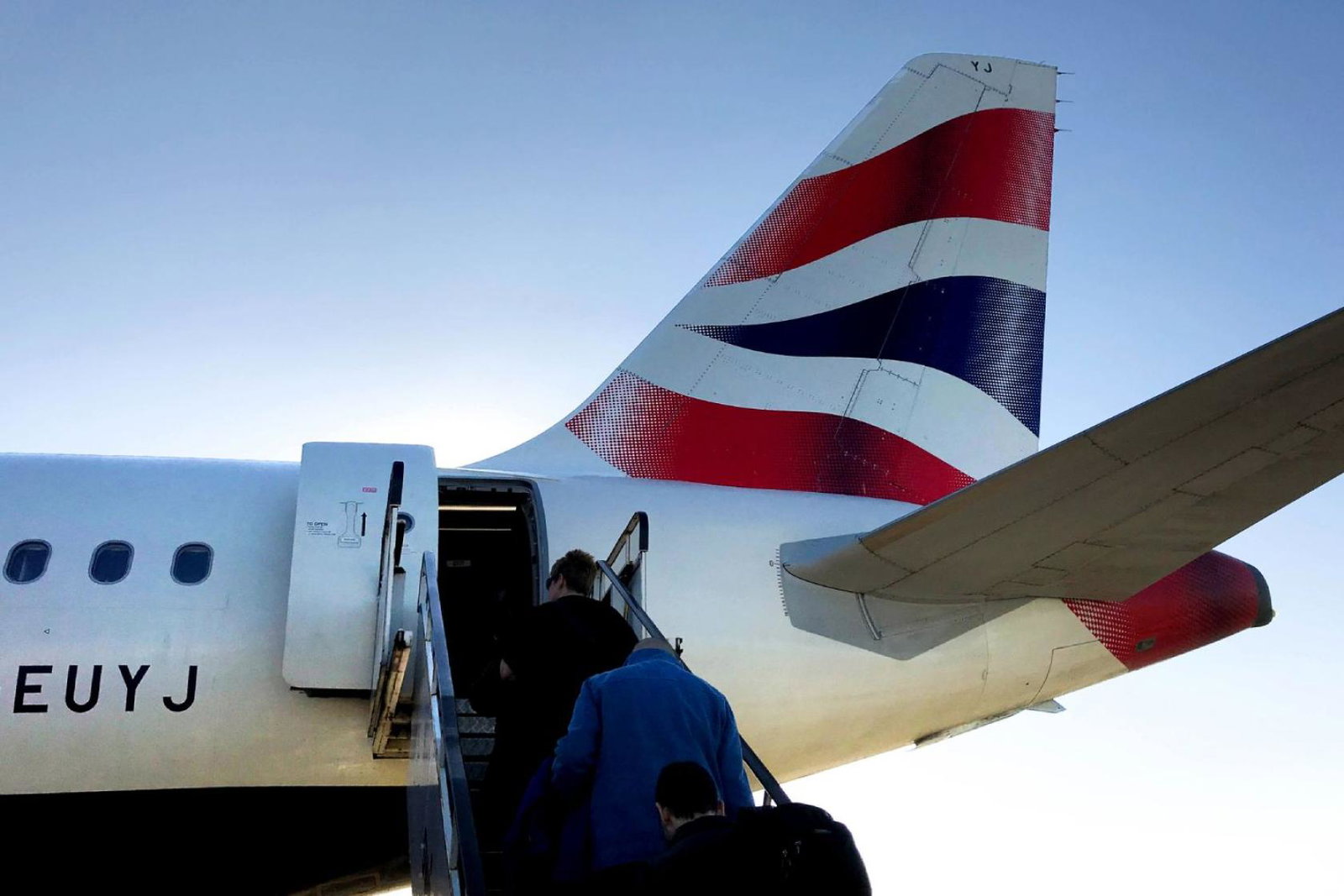 Tail of a British Airways plane during sunny day