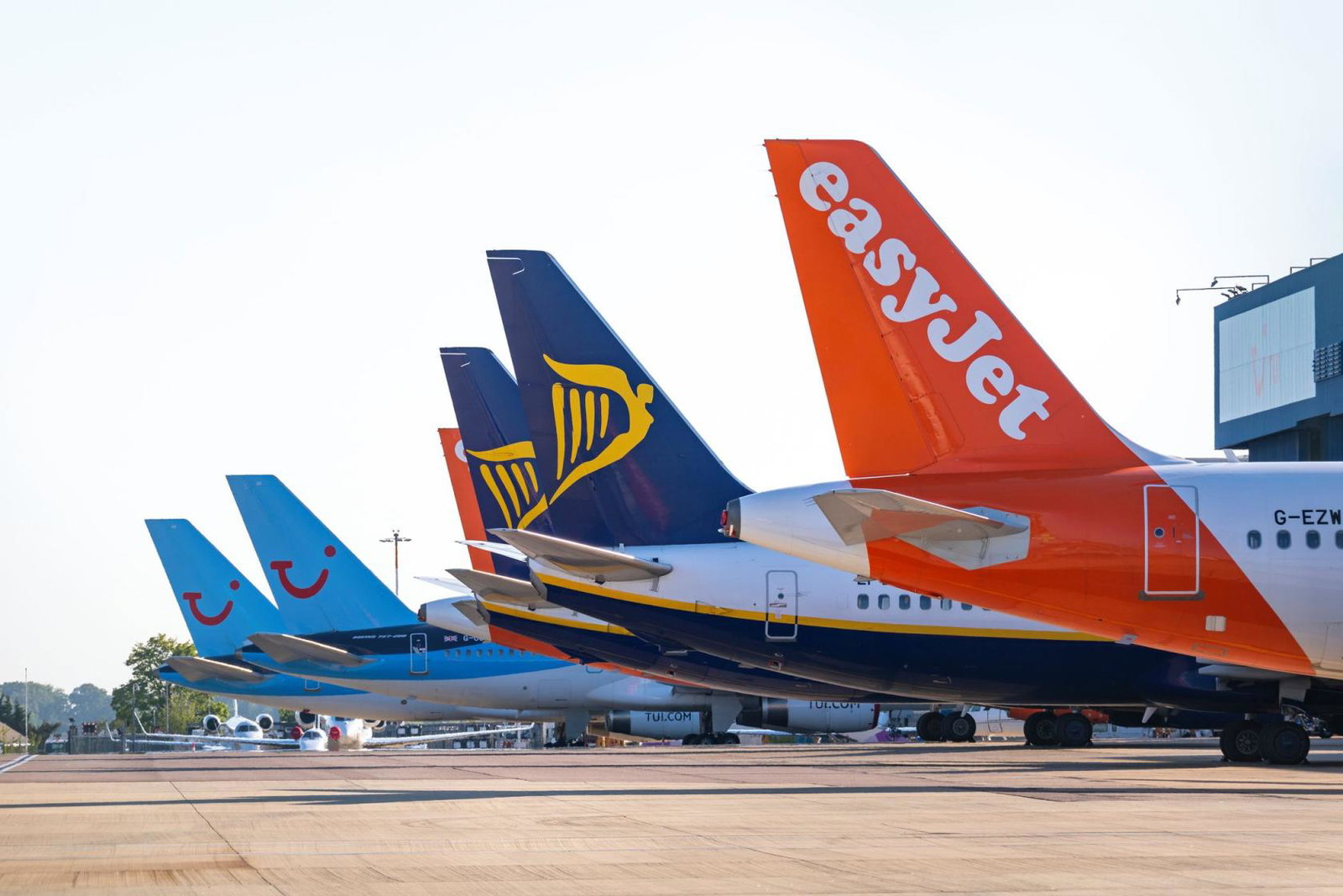 Tui, Ryanair and easyJet aircraft pictured at the stand at an airport
