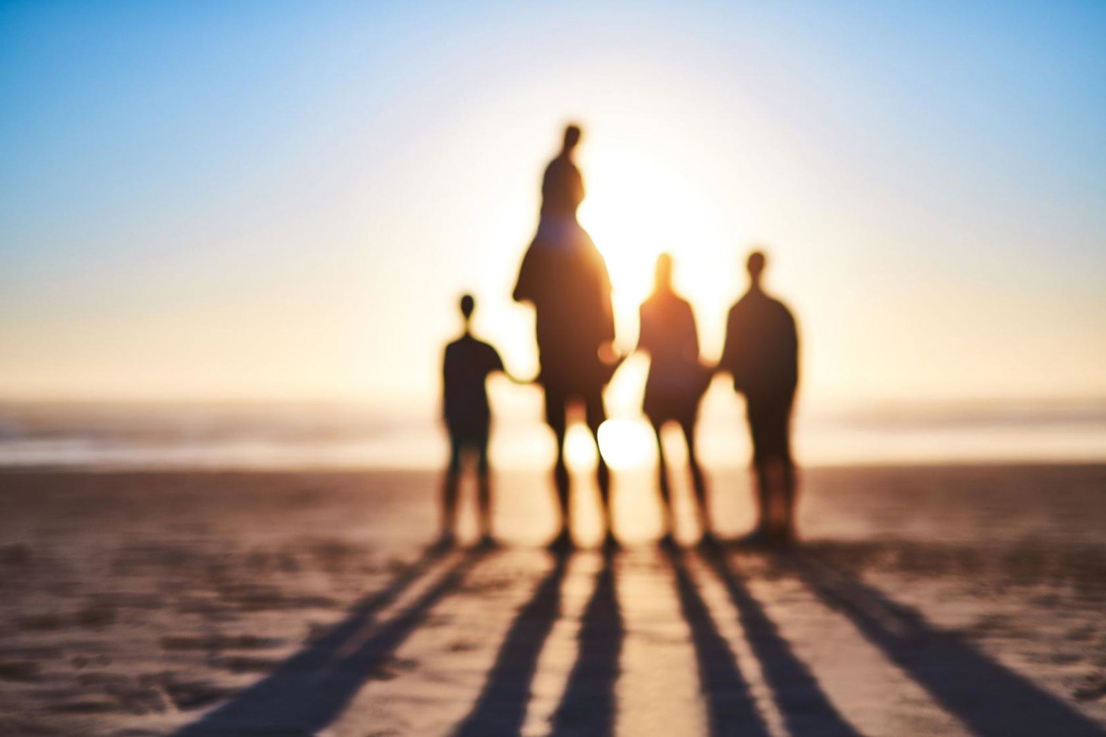A family play on the beach