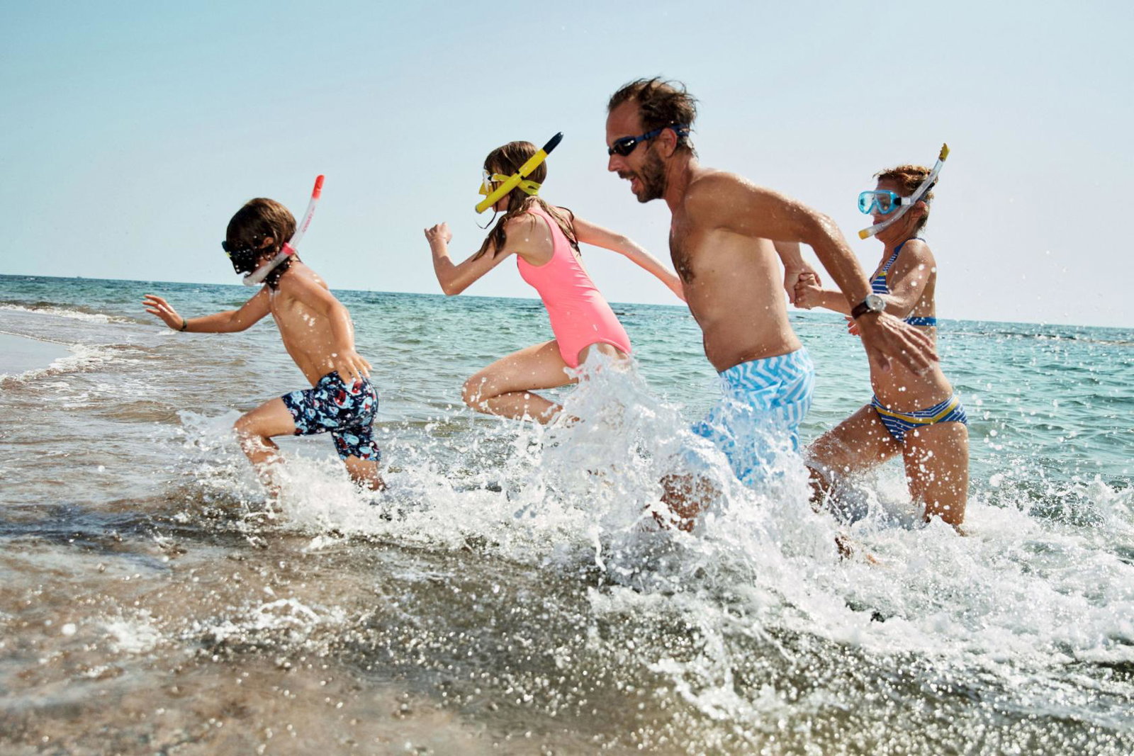 A family splash around in the sea