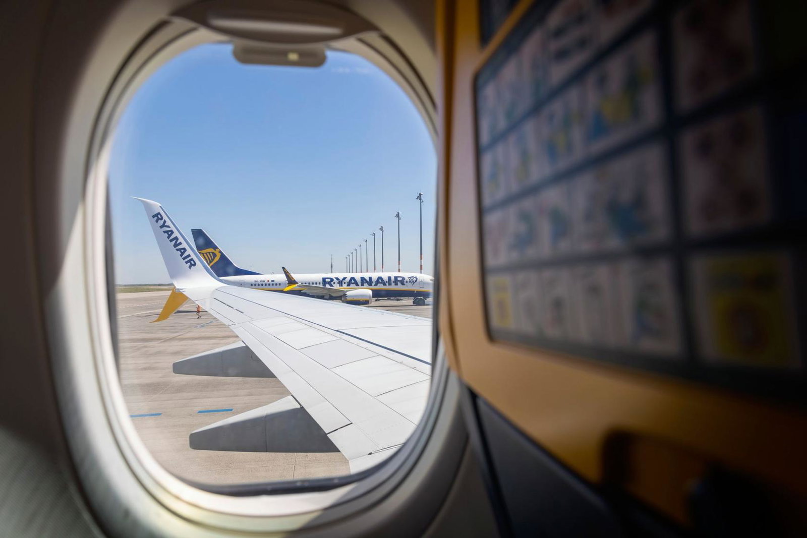 A Ryanair aircraft at the stand pictured through an aircraft window