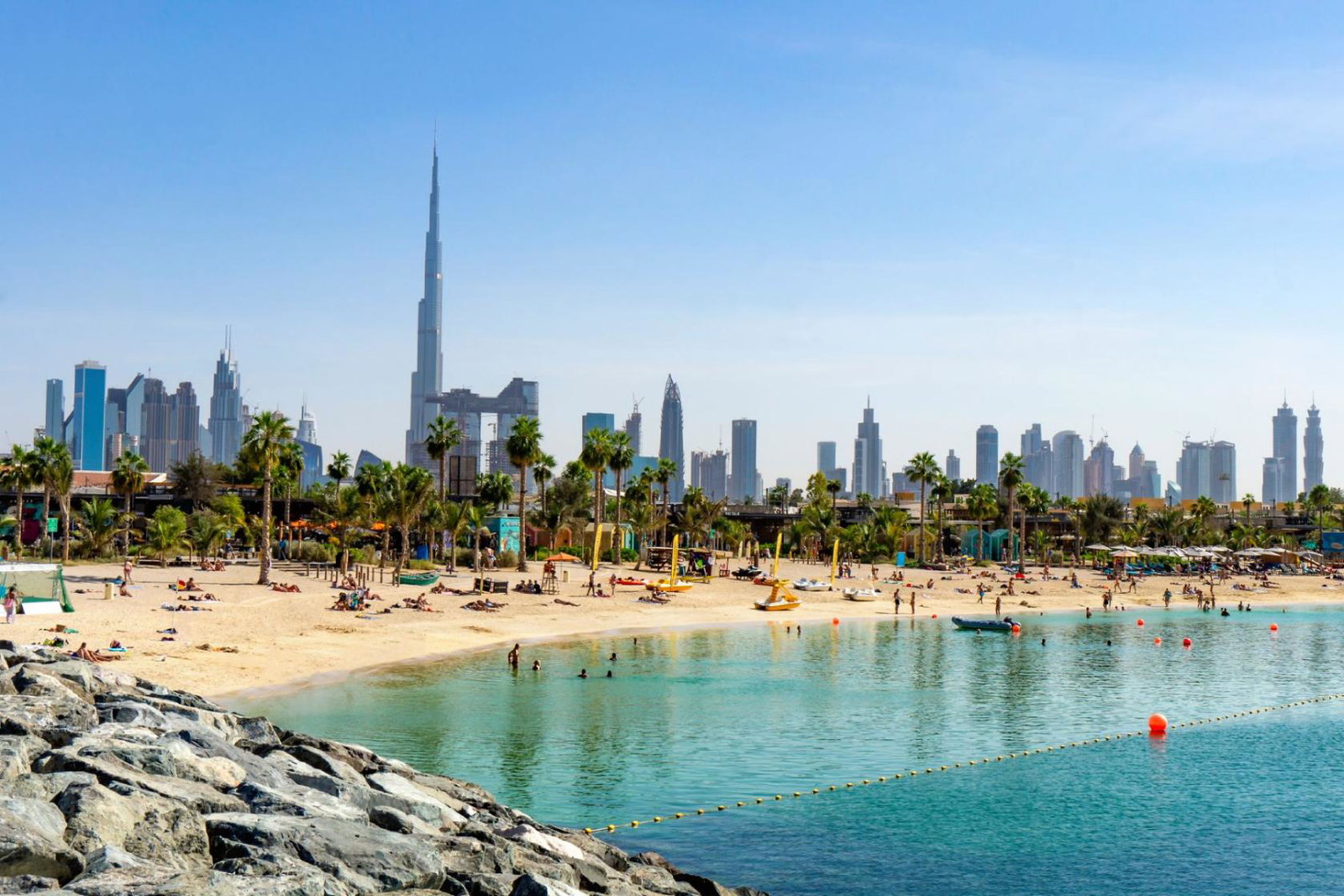 A beach in Dubai with the city pictured in the background