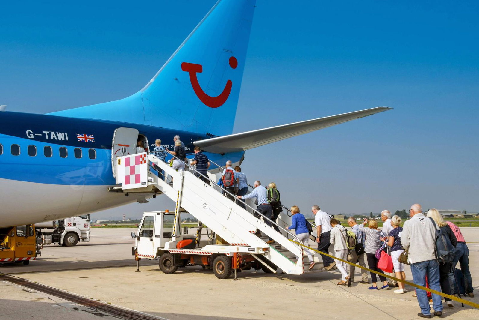 People board a Tui aircraft