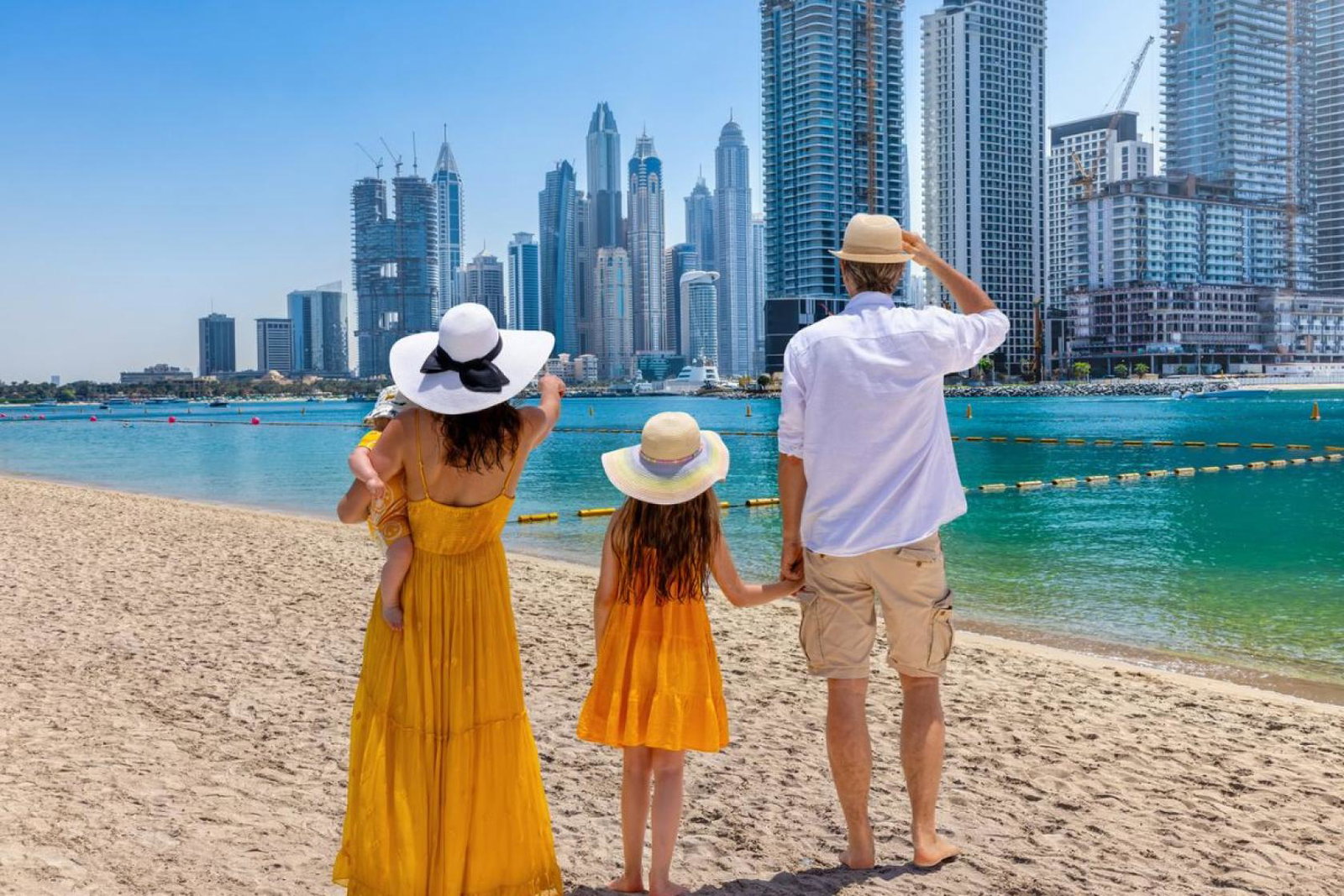 Family in front of Dubai marina skyline