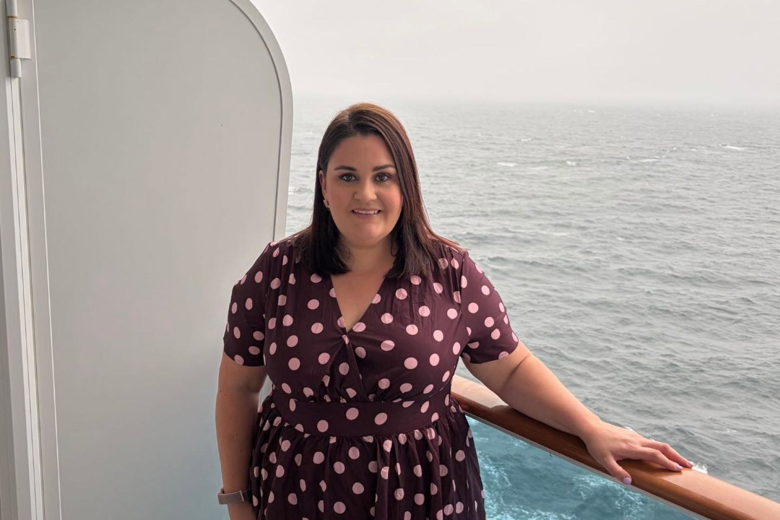 Woman smiling on cruise balcony