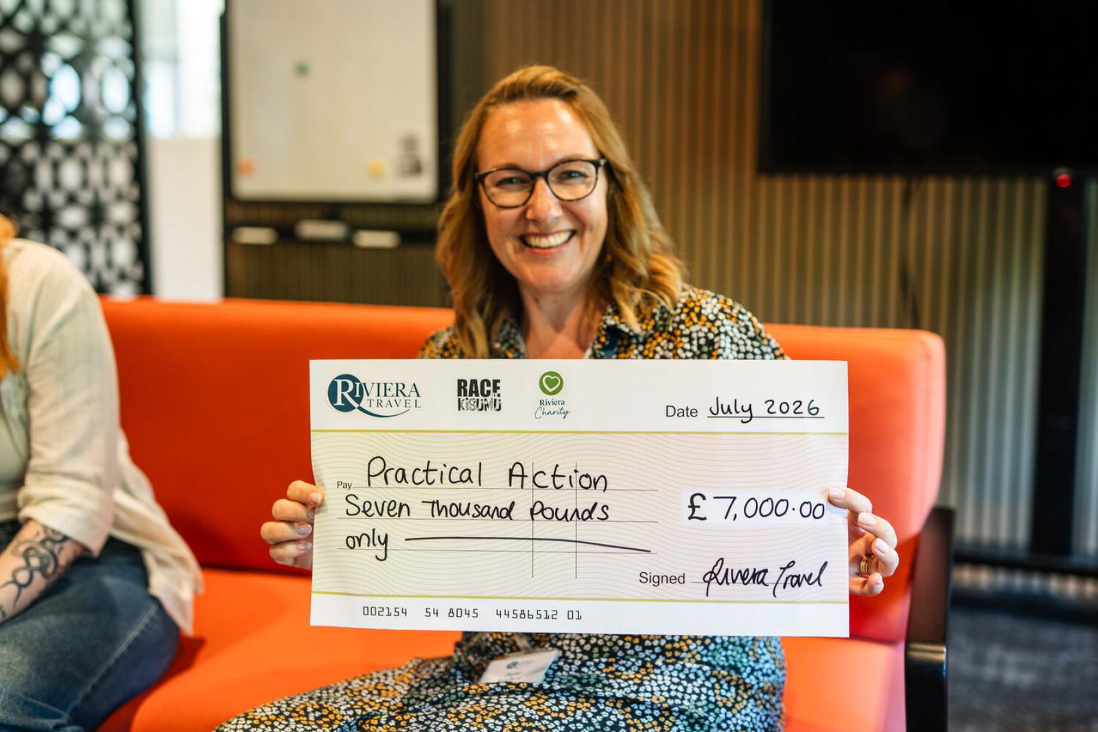 Office Manager and Head of Charity at Riviera Travel, Jane Walker, presenting Practical Action with a cheque for £7,000 
