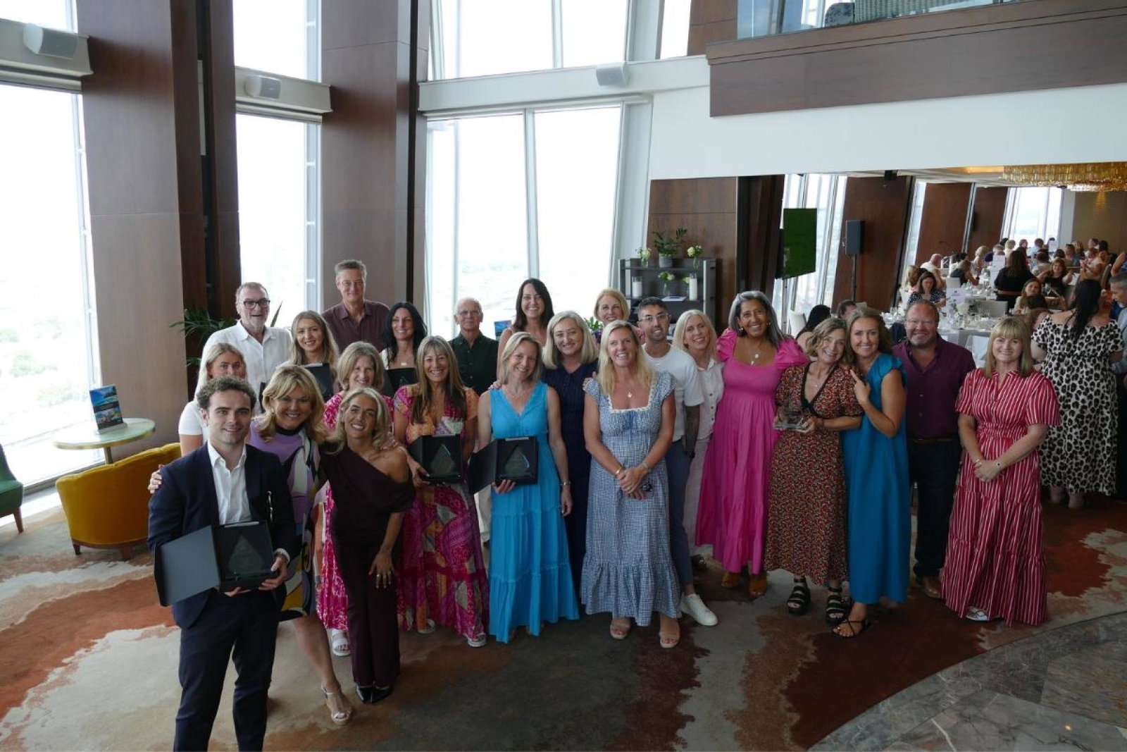 Group of people holding awards 
