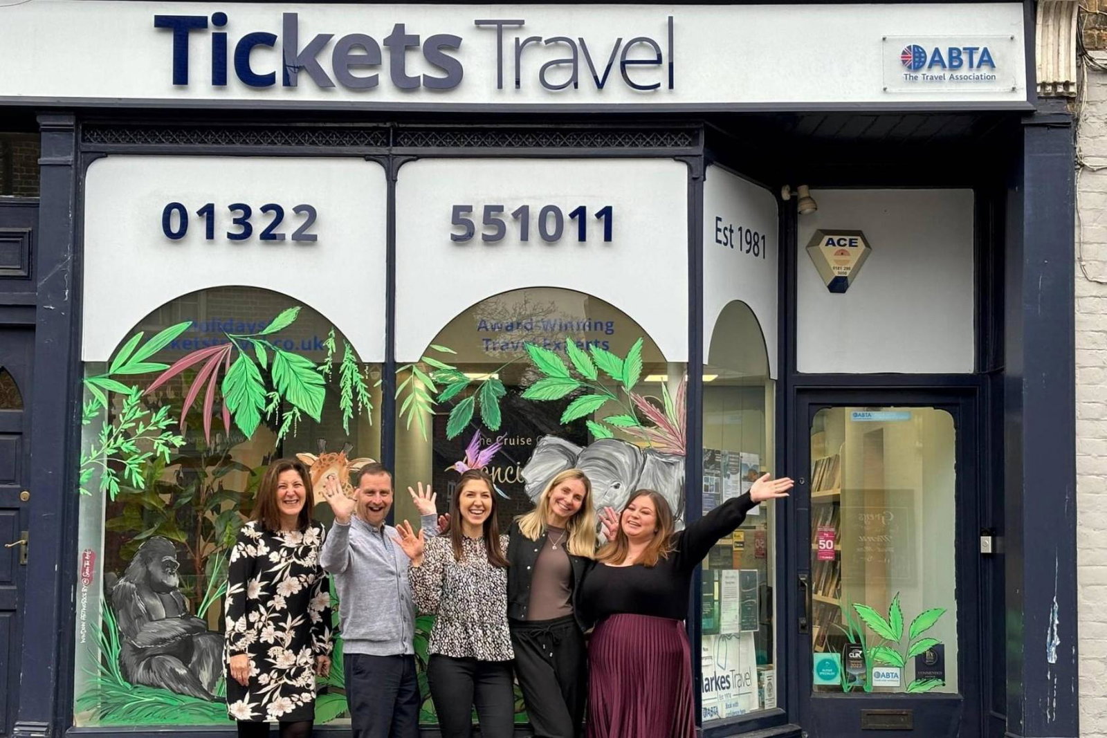 Tickets Travel team outside shopfront