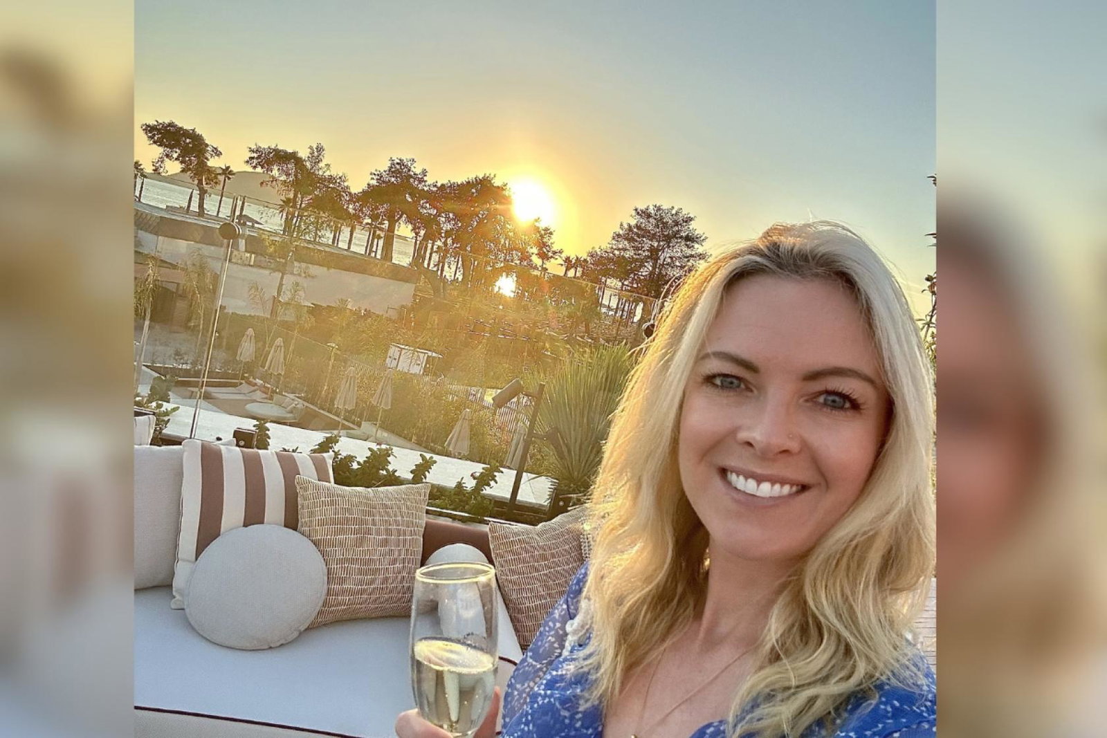 Blonde woman smiling with champagne 