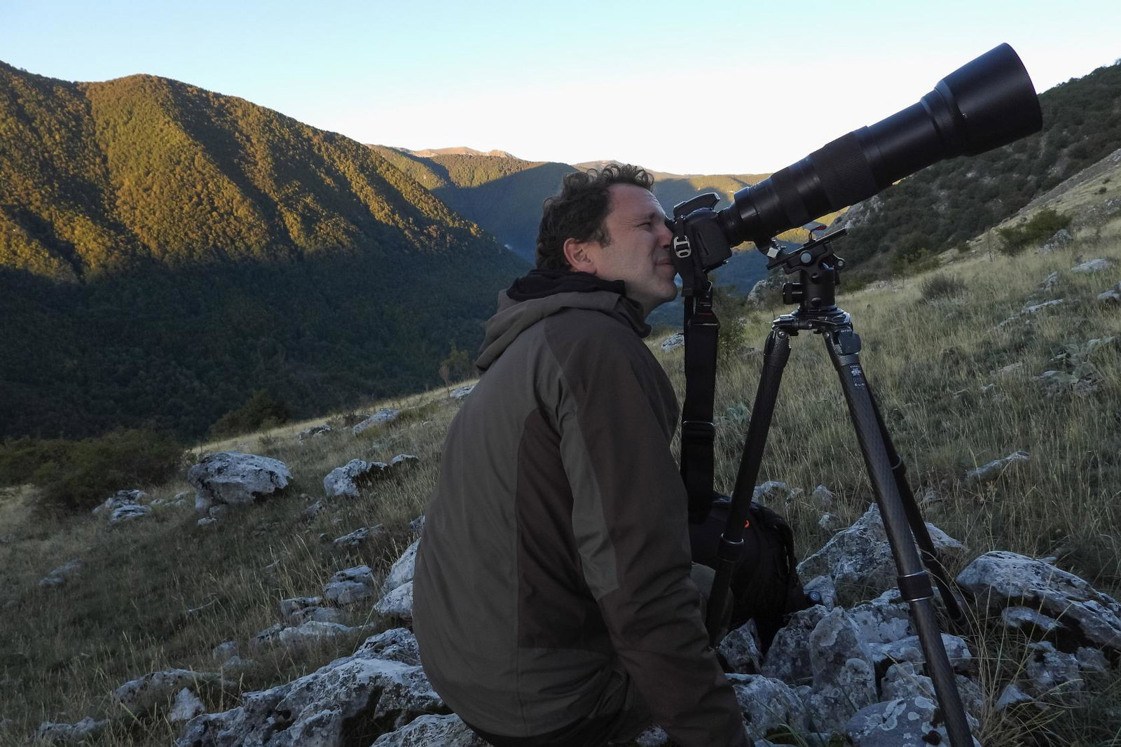 Man looking through camera on Exodus tour