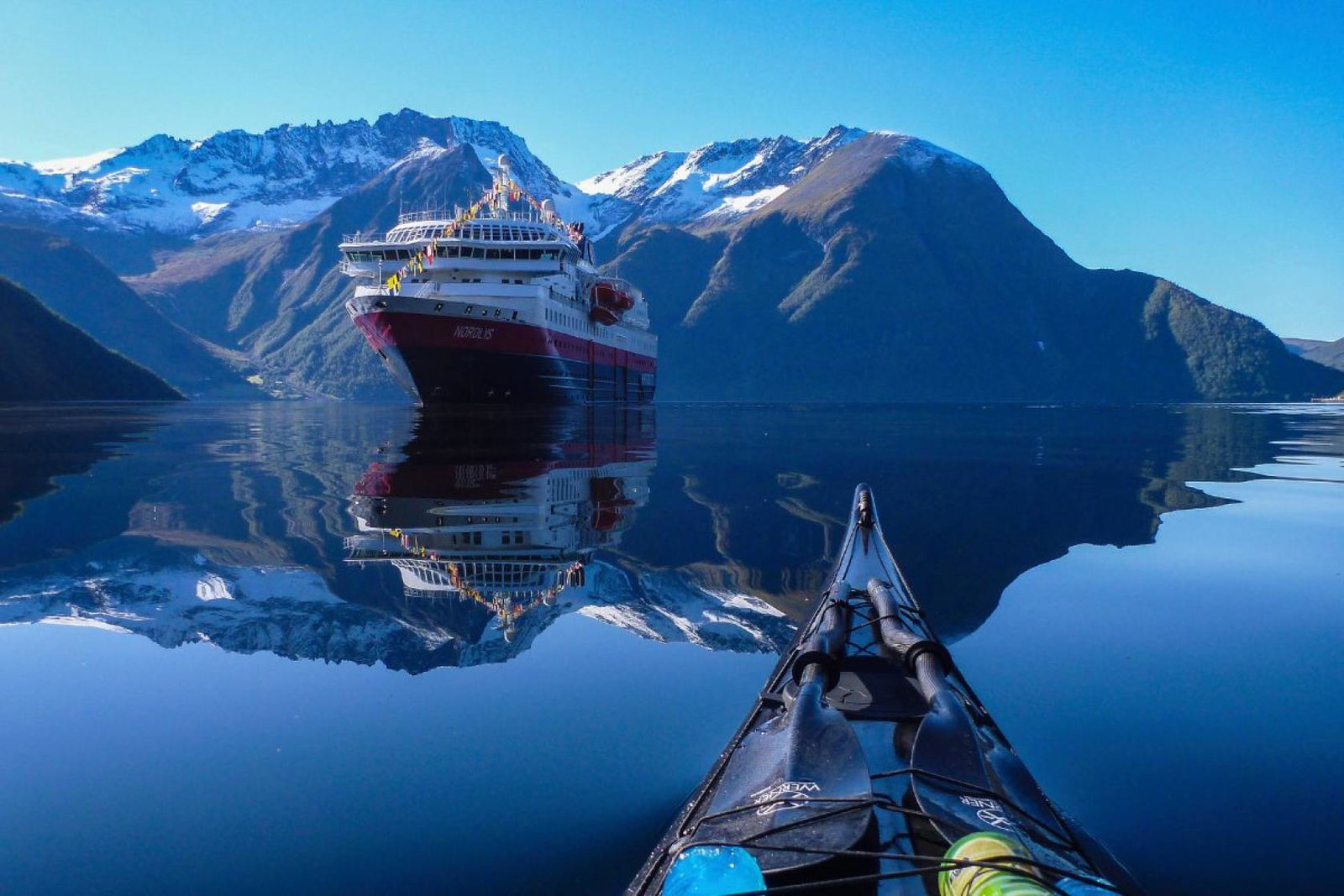 Hurtigruten ship in fjord setting