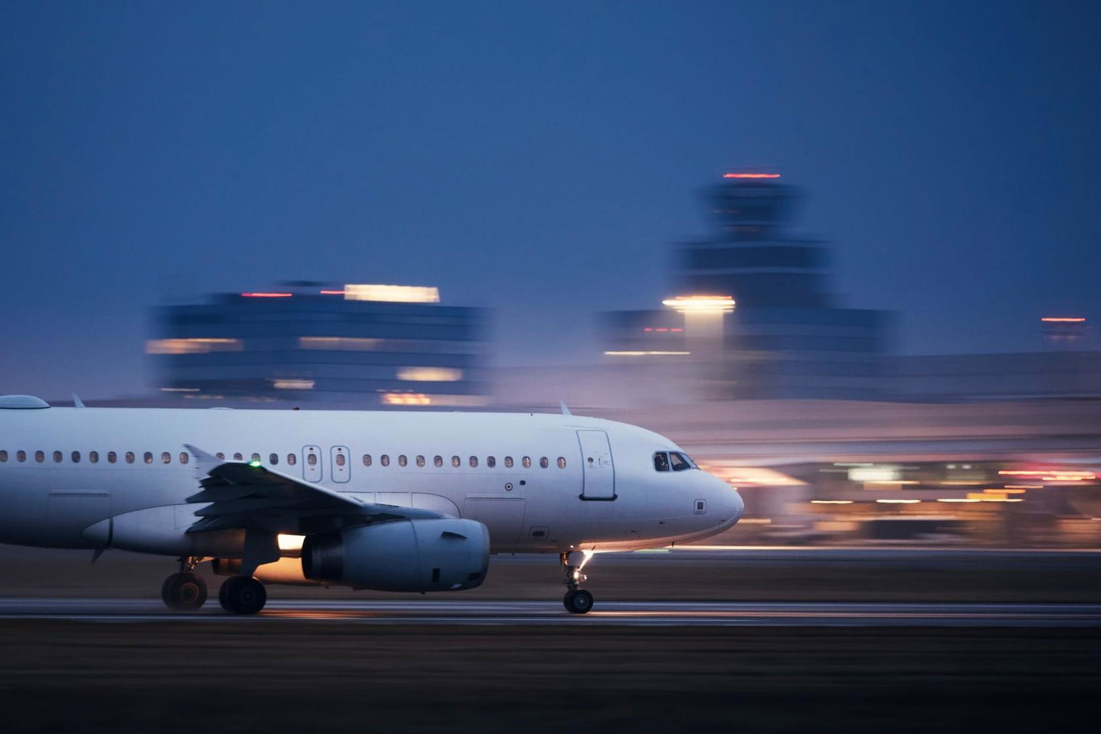 An aircraft taking off from an airport at night