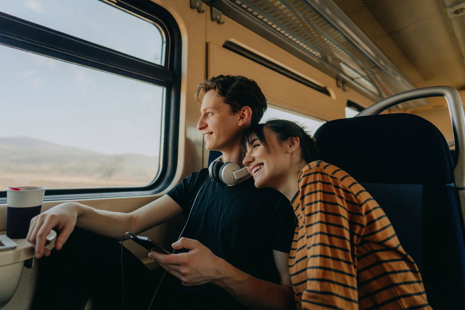 Young couple travelling by train