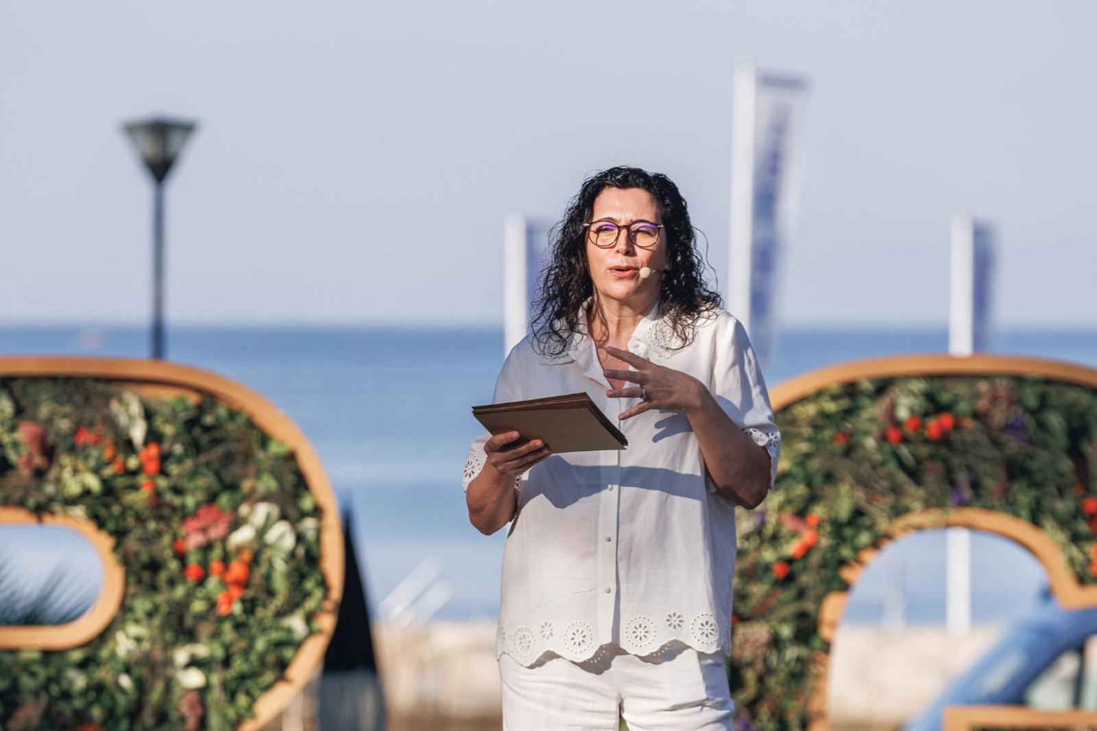 Woman speaking on stage 