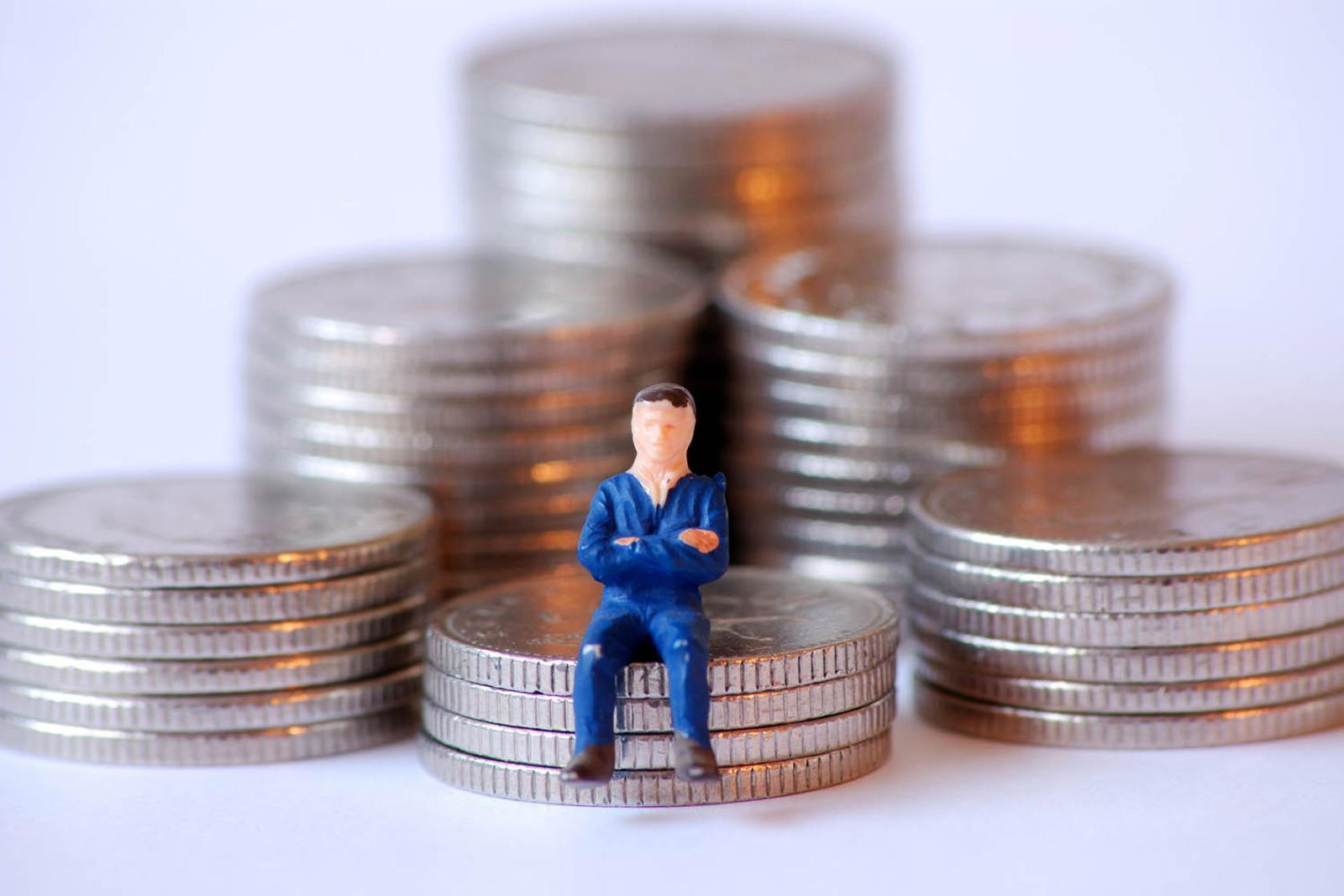 Tax / money - man on coins (stock)