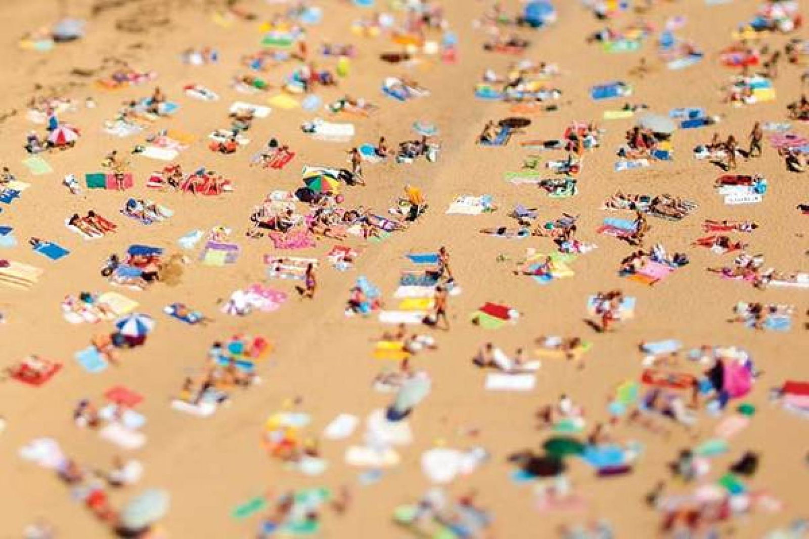 Spain beach sunbathers iStock_13962374