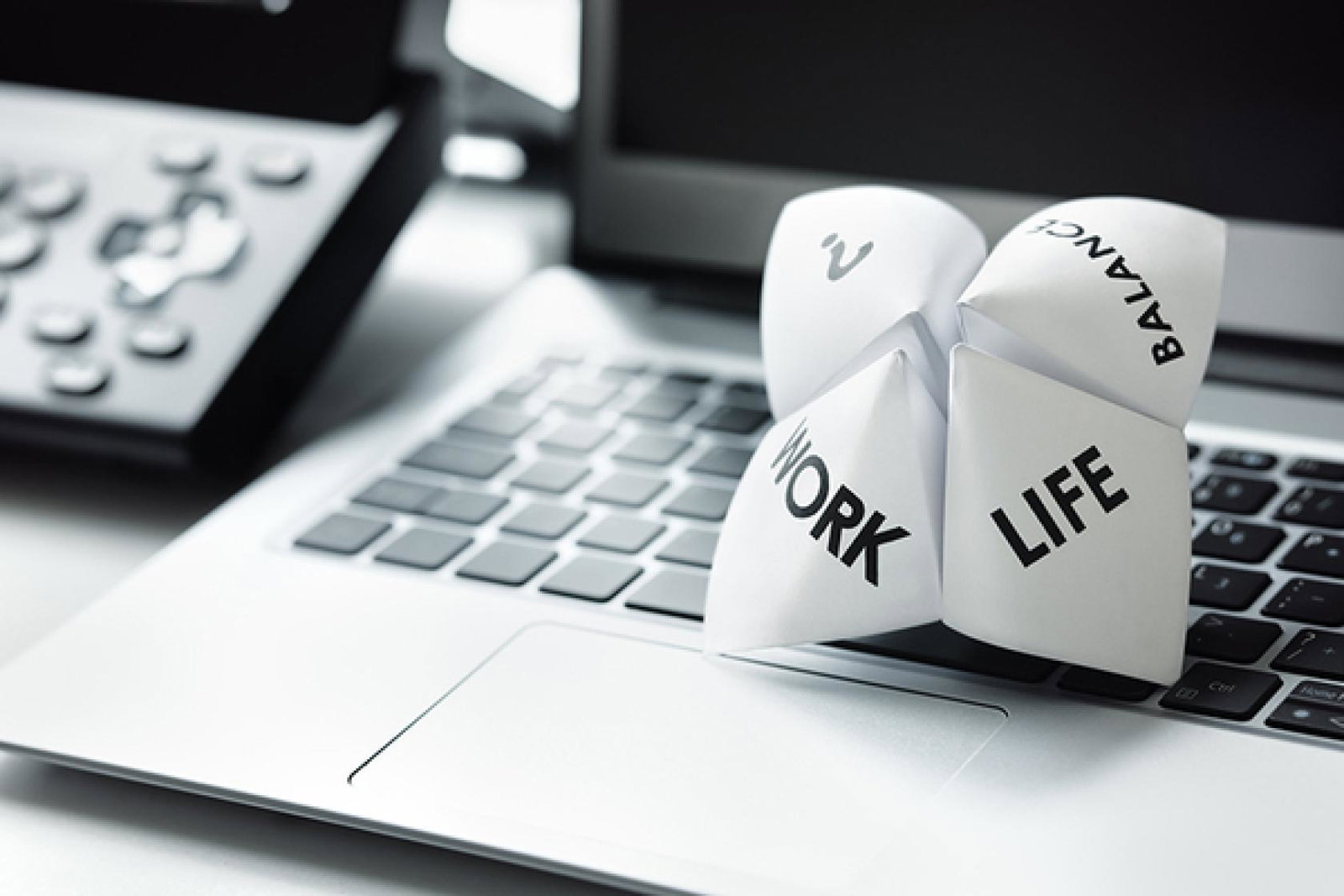 Work-life balance model on laptop