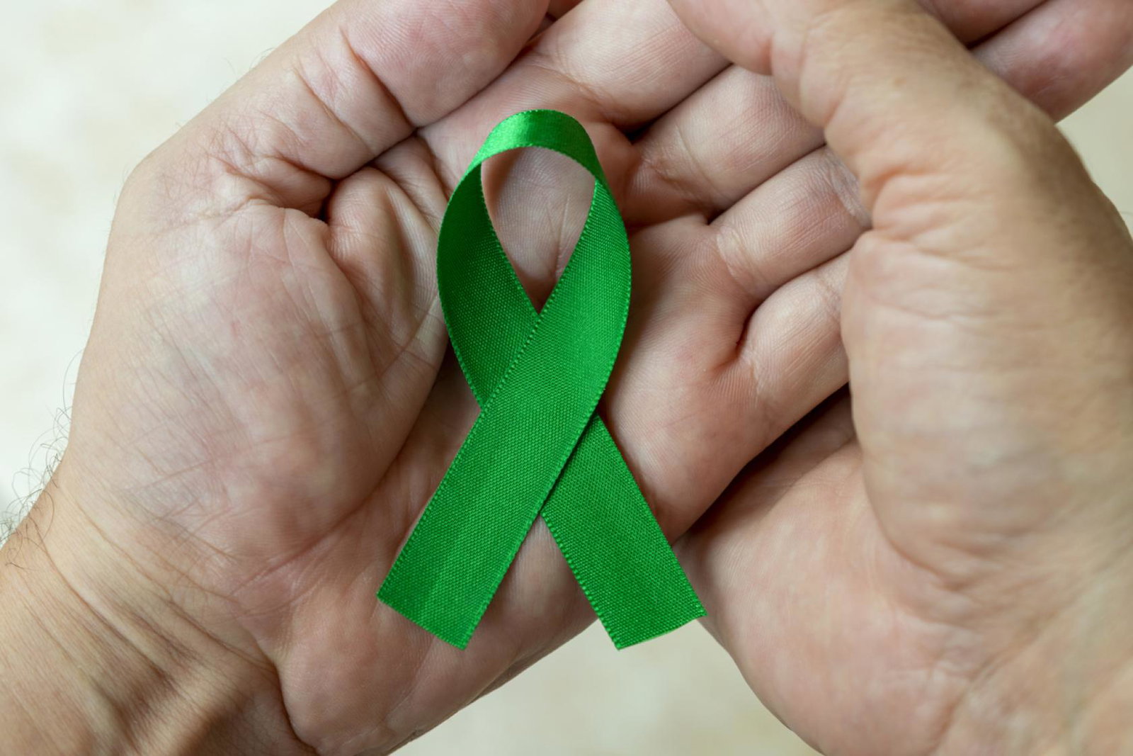 A green ribbon is the international symbol for mental health awareness