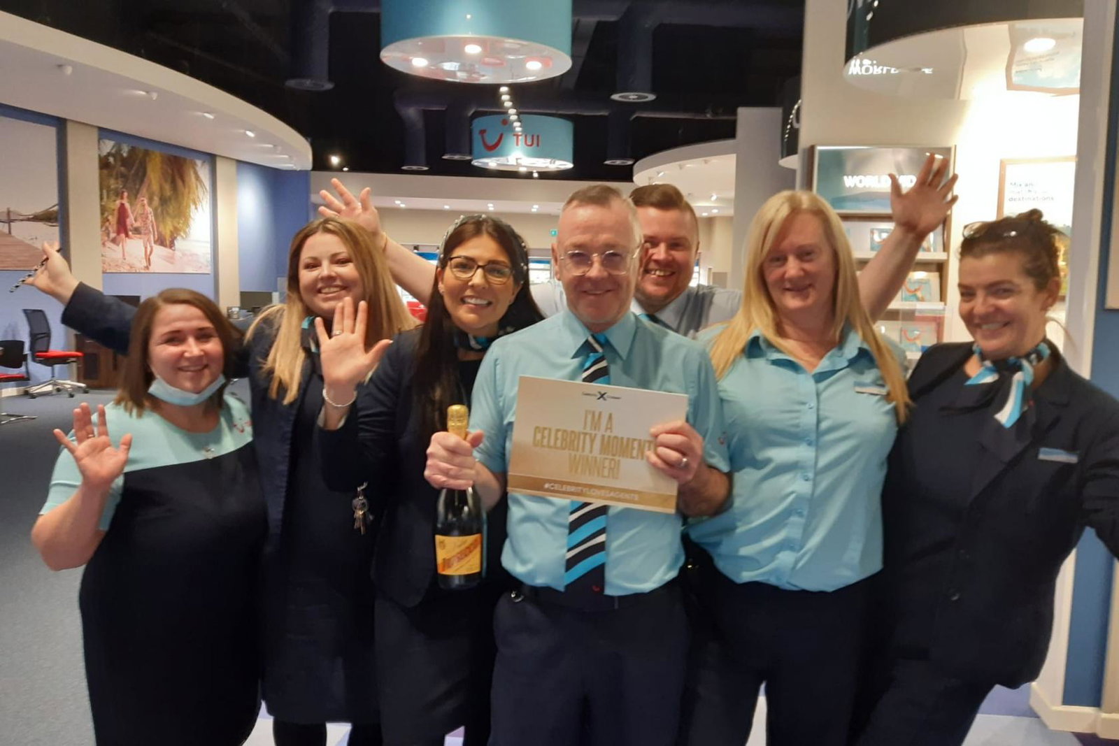 Tui agent Gareth Jones celebrates his Celebrity Moments win with his team