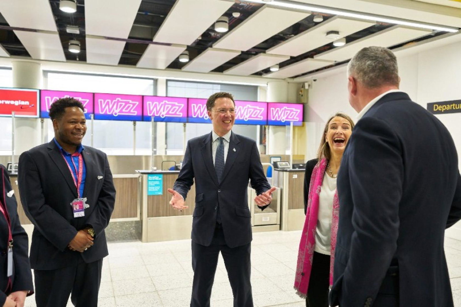 Courts (centre) met with airport and airline staff during his visit
