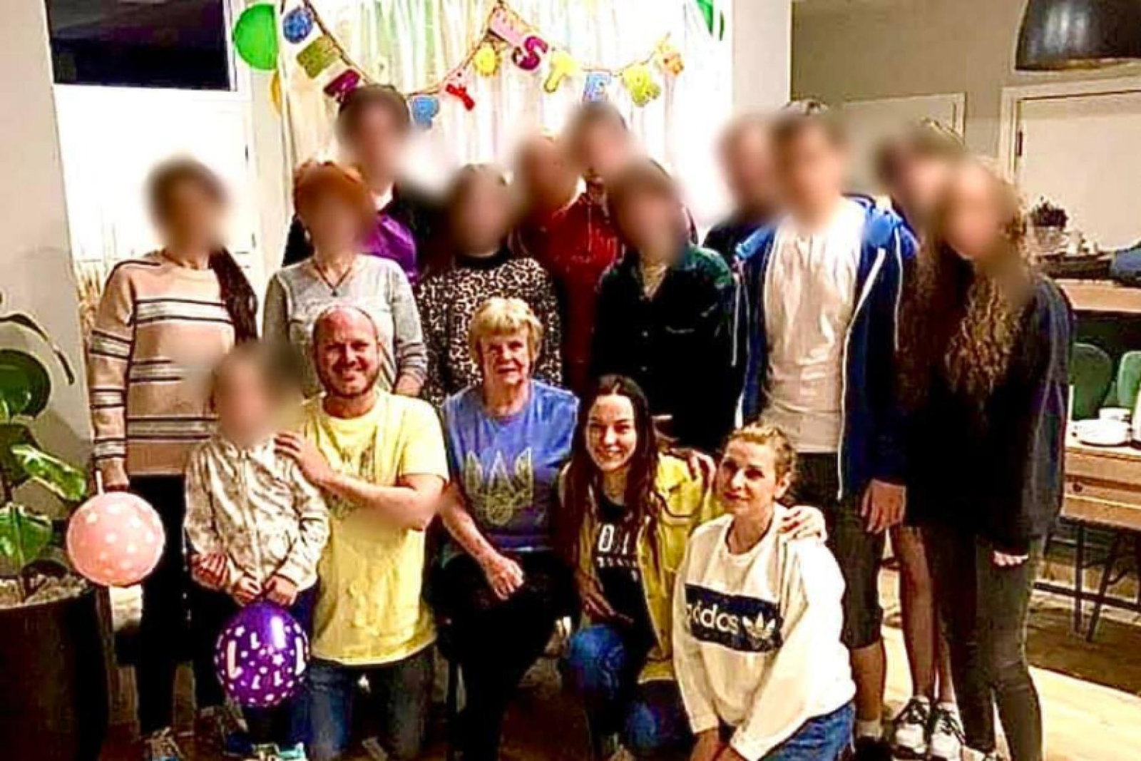 Neil Crawford (front centre left) with some of the Ukrainian refugees he has helped find a home in Poland. Some faces have been blurred for security reasons