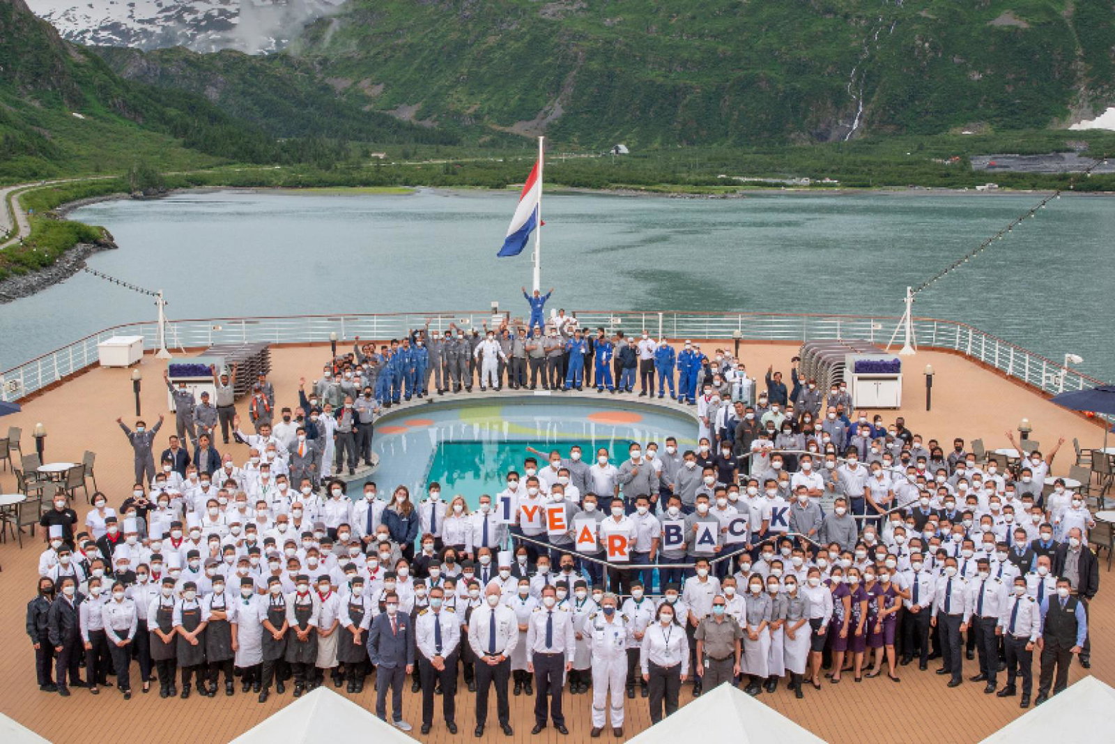 Nieuw Amsterdam crew celebrate one year of cruising on 24 July as the ship sails in Alaska