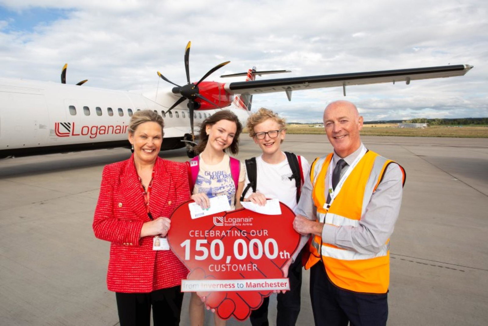 (L-R) Donna McHugh, head of revenue and sales at Loganair; Archie and Florrie Gray and Dan Mason, airfield operations manager at Inverness airport