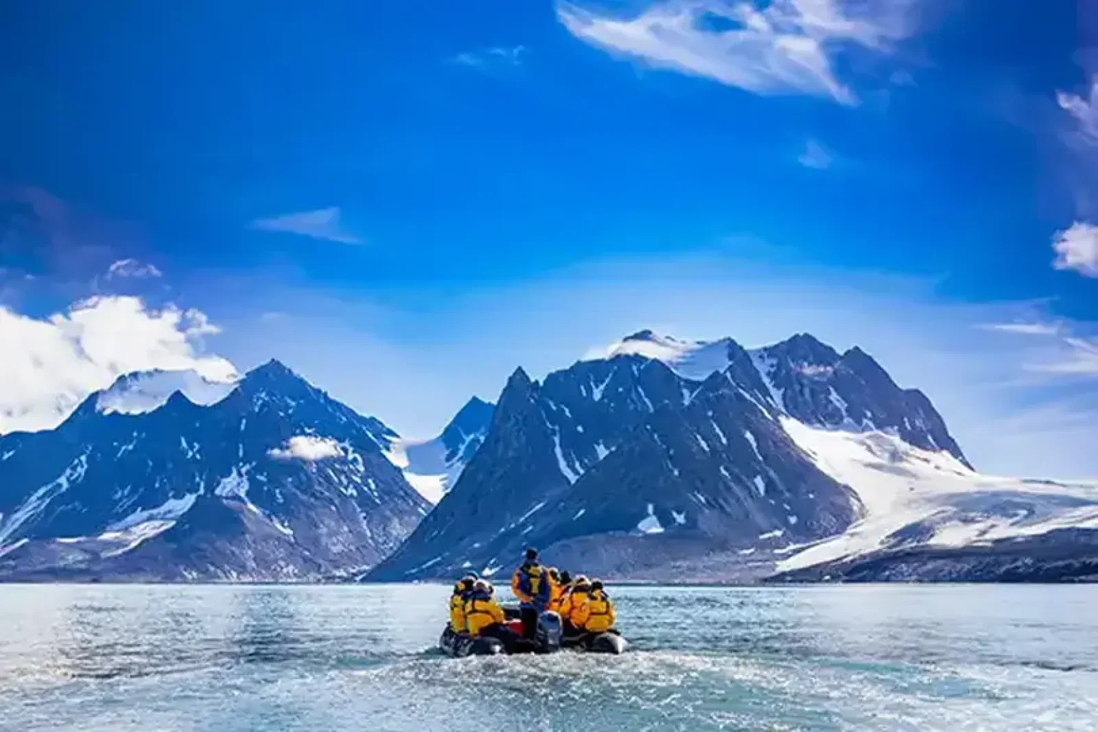 Clients can cruise by zodiac through the waters in Svalbard with Quark Expeditions. Credit: Michelle Sole  