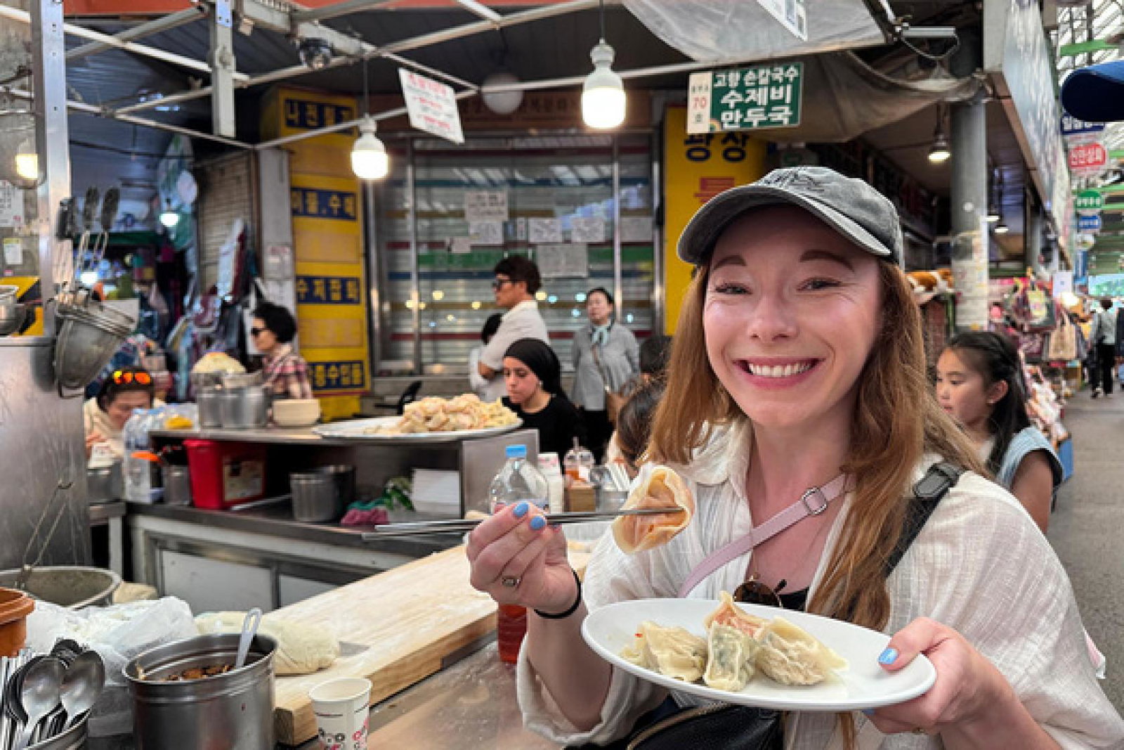 Our writer Madeleine Barber in Gwangjang Market, Seoul