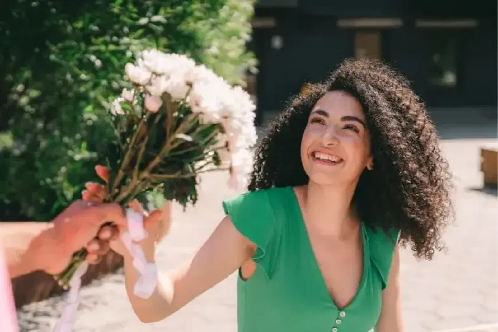 Woman taking flowers