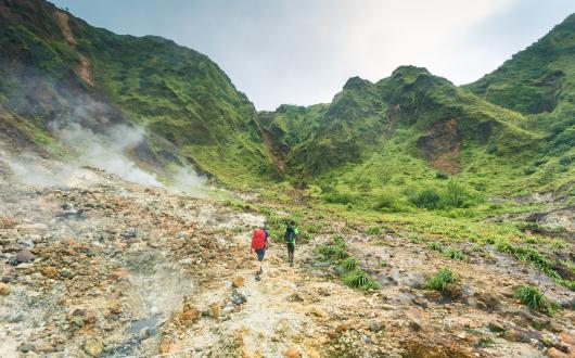 Two hikers on a trail in Dominica
