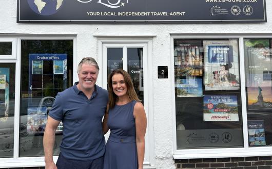 Rod and Clare Stege outside the first CLS Travel shop in Littleover 