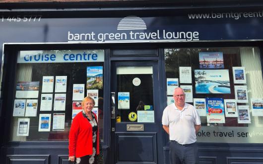 Barnt Green Travel Lounge's Linda Green and Mike Allsopp pictured outside the agency