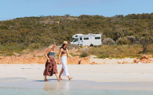 Two women exploring with their Apollo EuroDeluxe motorhome in Eagle Bay, Australia