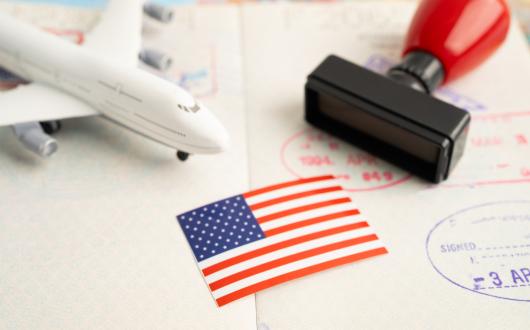 A mock up of an aircraft with a US flag and passport stamp