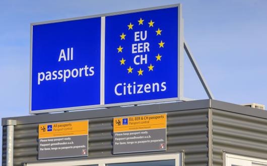 A border control point asking for all passports with the EU stars