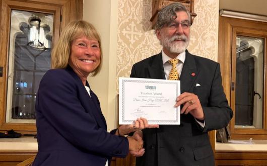 Dame Irene Hays receives the 2025 Tourism Society Award from Lord Thurso