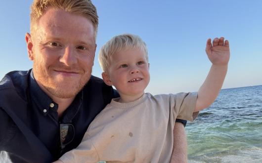 Tom Parry with his two year old son Theo on holiday in Crete