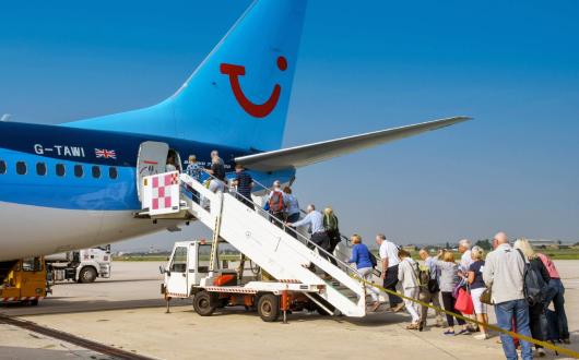Passengers board a Tui aircraft